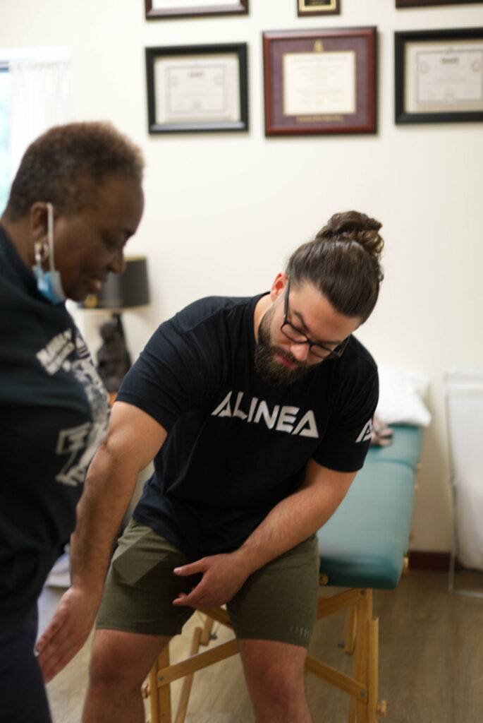 Dr. Mills working with a females knee